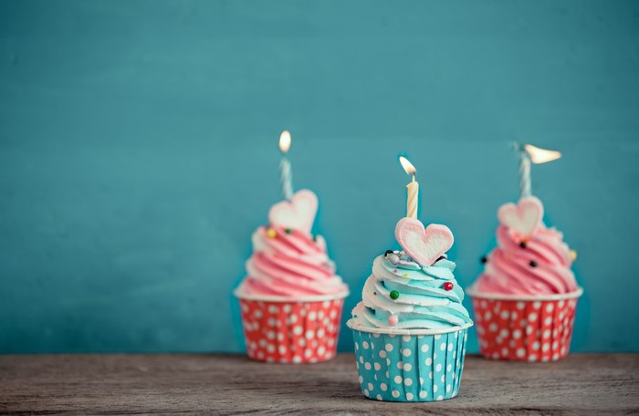 Three Cupcakes with Candles and Heart Toppings