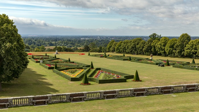 Cliveden Garden with formal flower beds and distant landscape