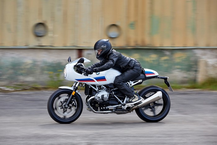 BMW R nineT Racer motorcycle with rider in motion