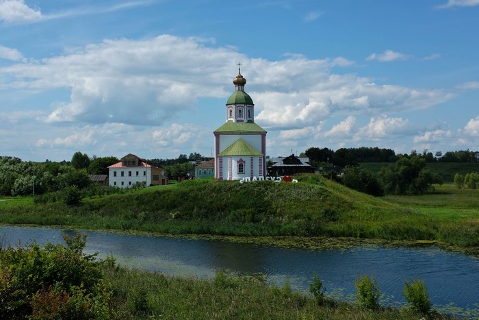 Church on a hill overlooking a river in Suzdal, Russia