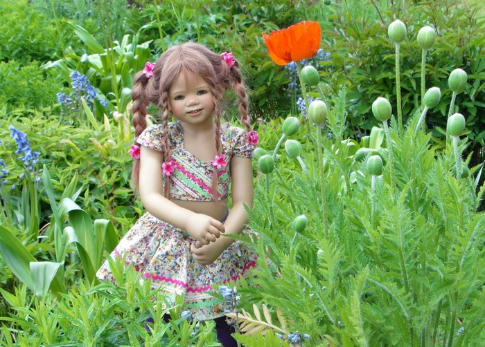 Doll in a garden with poppies at Grugapark Essen