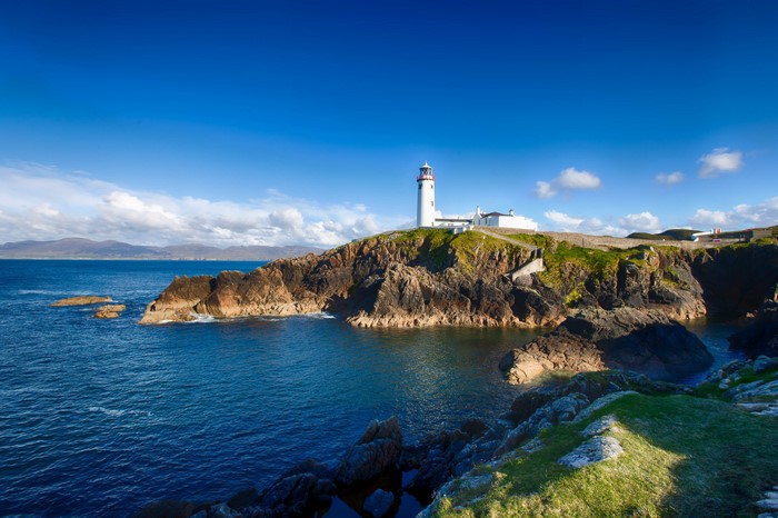 Lighthouse on a rocky coast in Ireland