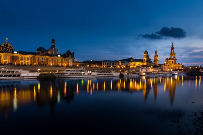 Dresden historical center and riverboats at dusk