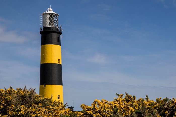 Black and yellow lighthouse in Ireland