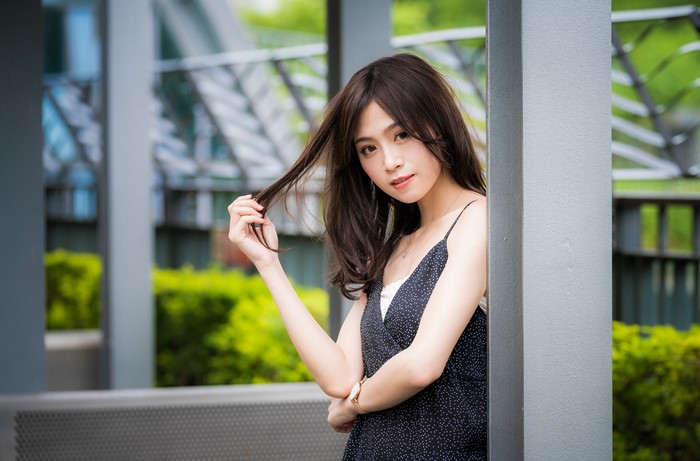 Asian Brunette Girl Playing with Hair