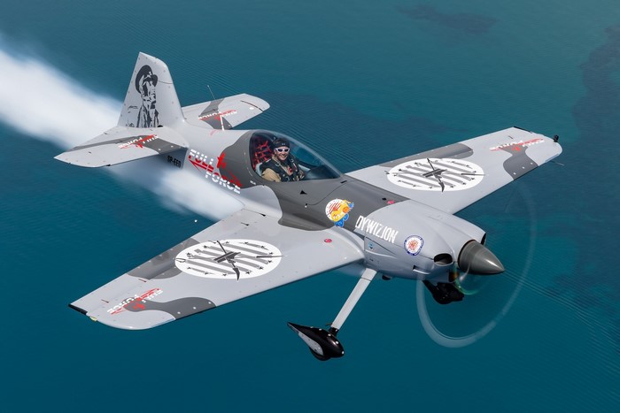 XtremeAir Sbach 300 aerobatic airplane flying over water