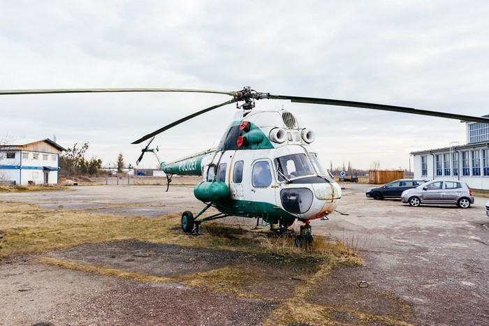 Police helicopter parked on an airfield