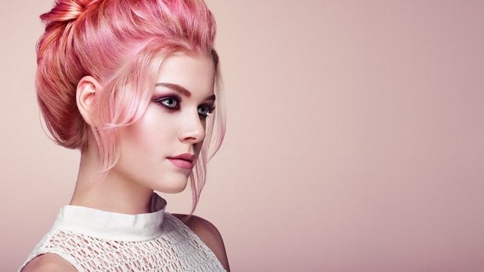 Woman with pink hairstyle and makeup