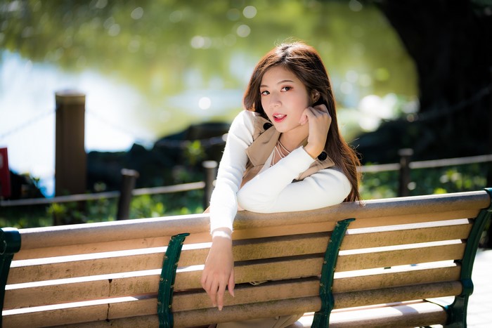4K Portrait of Woman Posing on Park Bench