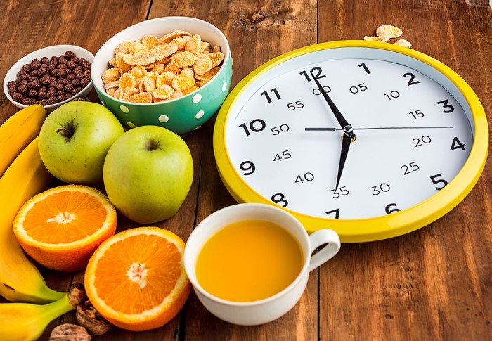 Breakfast with Fruit, Cereal, and a Clock