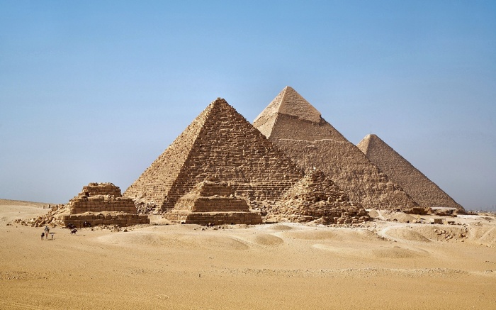 The Pyramids of Giza under a clear blue sky