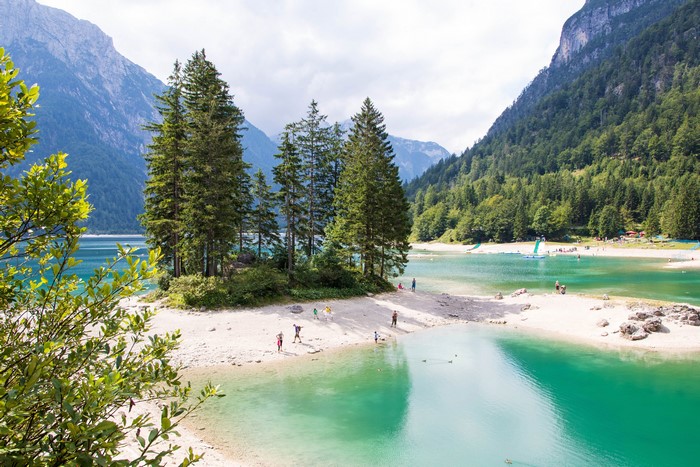 4K Predil Lake with Mountains and Spruce Forests