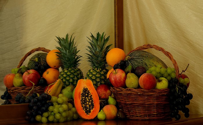 Still-life fruit arrangement in wicker baskets