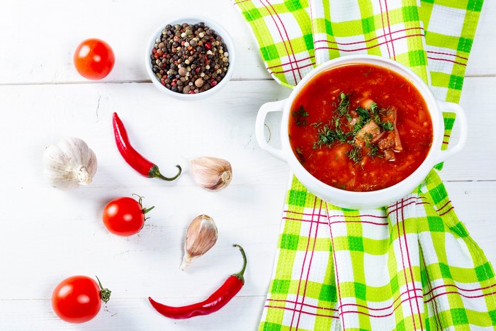 Borscht soup with tomatoes, chili peppers, garlic, and peppercorns