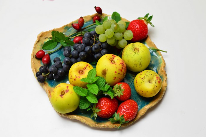 Apples, Grapes, Strawberries, and Rose Hips on a Plate