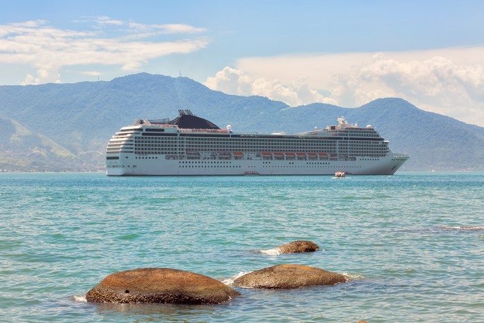 Cruise liner on the sea with mountains