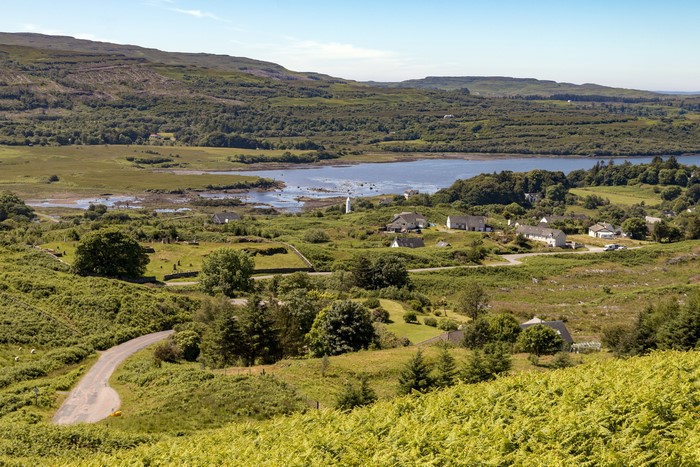 Village of Dervaig with a bay and surrounding hills
