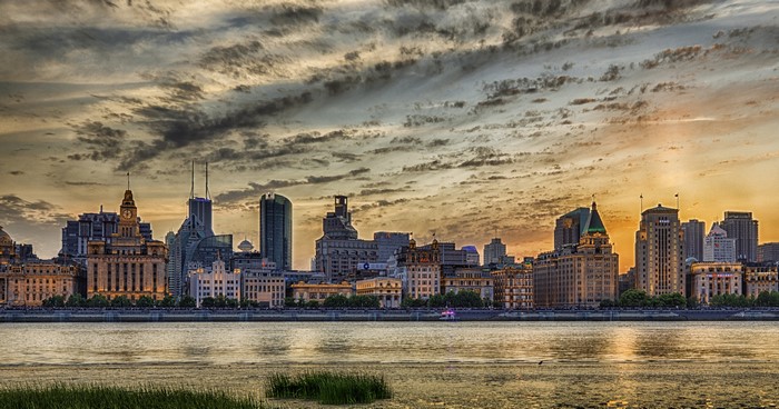 Shanghai skyline at sunset over the Huangpu River