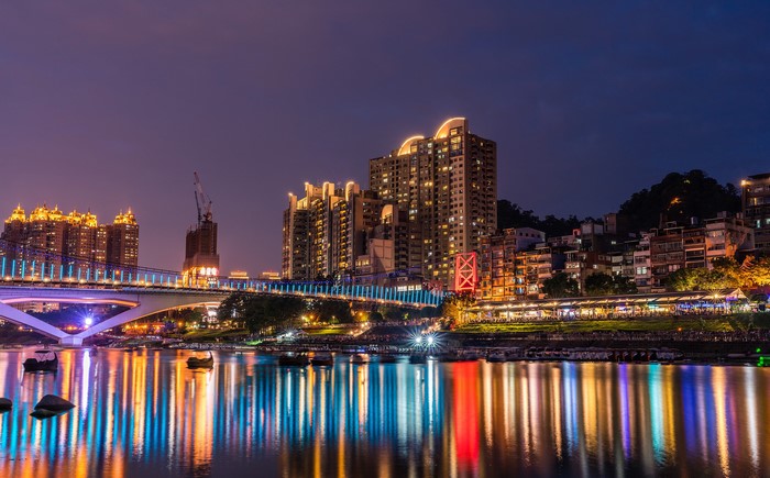 New Taipei Cityscape with Bridge and River at Night