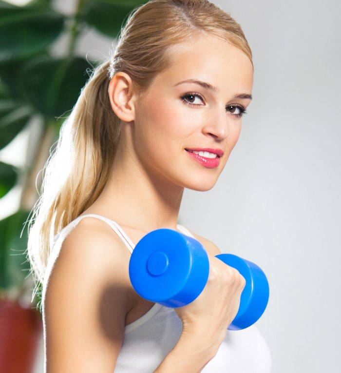 Blonde Woman Lifting Blue Dumbbell