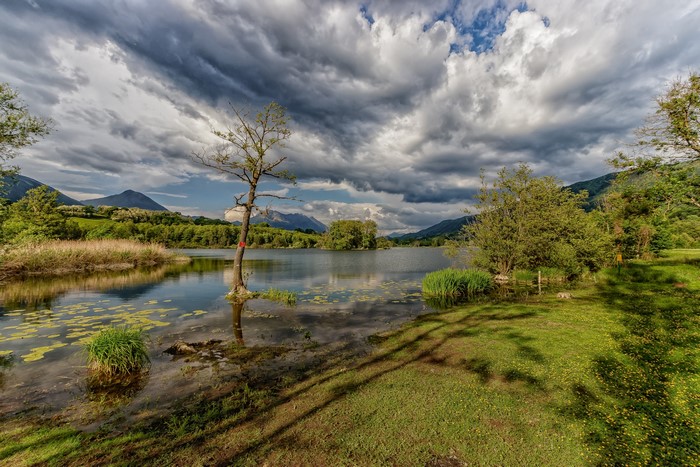 Lake with Mountains and Dramatic Clouds