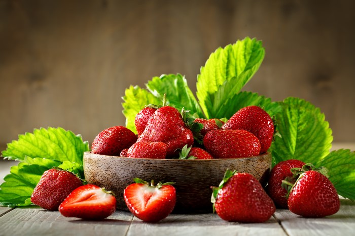 Strawberries in a Bowl with Leaves