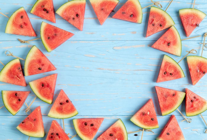 Watermelon Slices on Blue Wooden Background