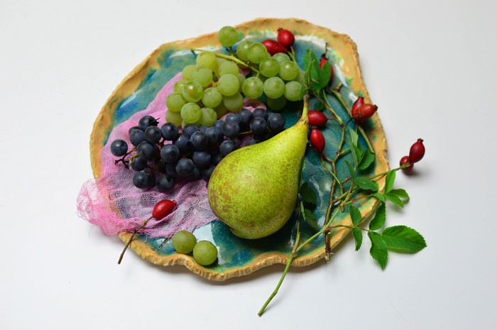 Grapes, Pears, and Rose Hips on a Decorative Plate
