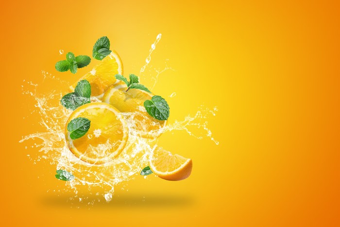 Orange fruit with mint and water splash
