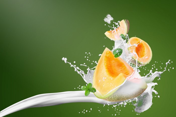 Melon Slices Splashing in Milk with Mint and Butterfly