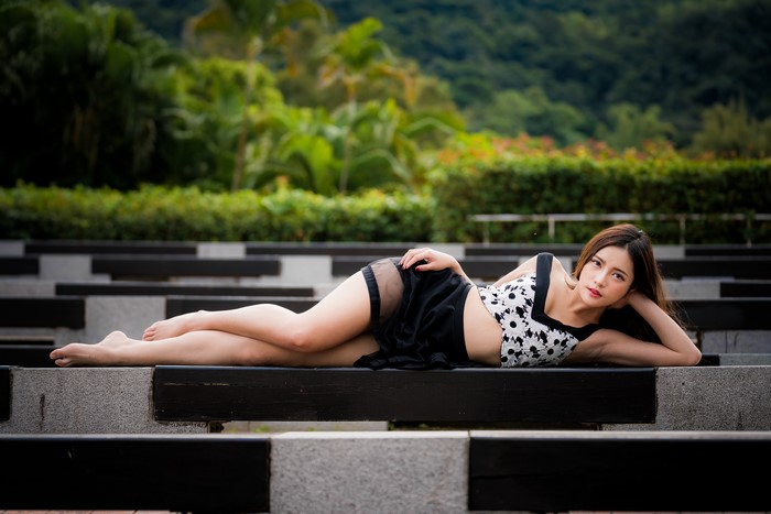 4K Asian Woman Lying Down in Black and White Dress