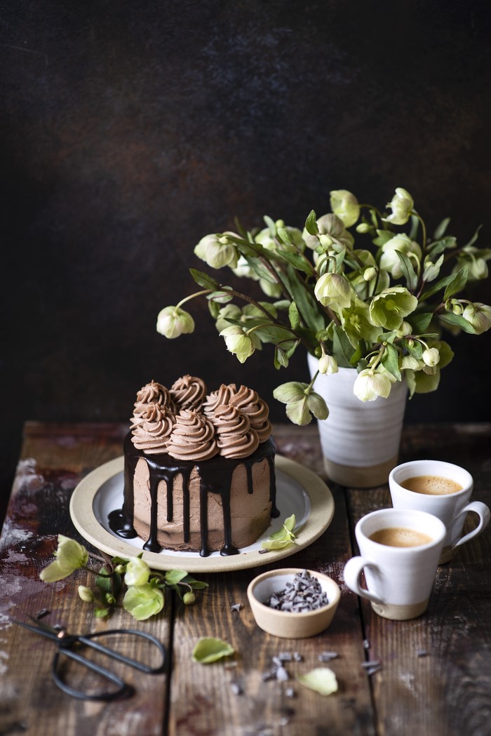 Chocolate cake with hellebores and coffee