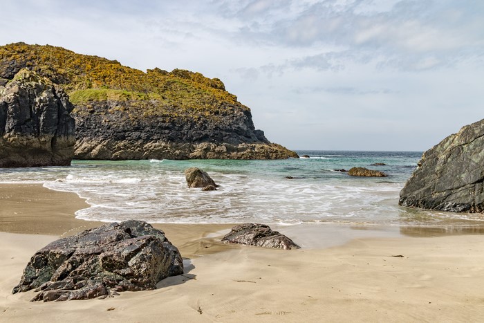 Kynance Cove beach with rocks and waves in England