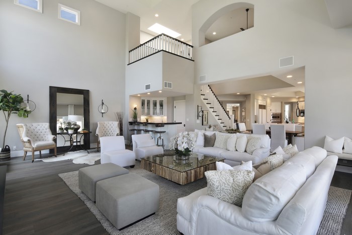 Modern Living Room with High Ceilings and White Furniture