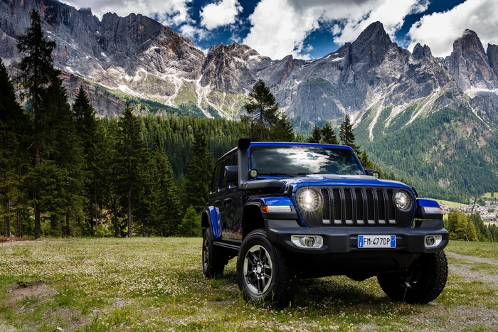 Blue Jeep Wrangler Unlimited Sahara 1941 by Mopar in mountains