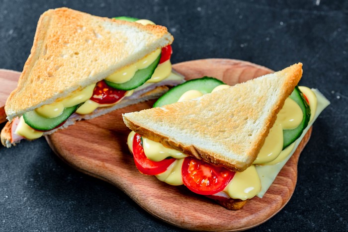 Two sandwiches on a cutting board