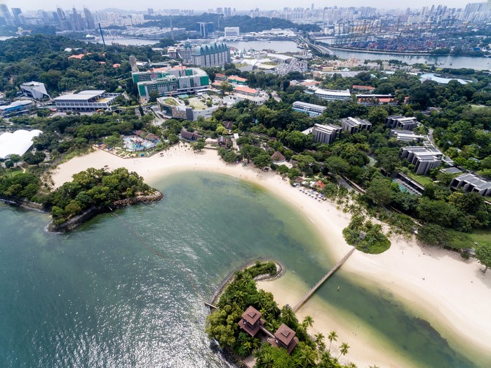 Aerial view of Palawan Beach, Singapore with buildings and coastline