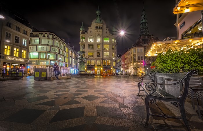 Copenhagen town square at night with Louis Vuitton store