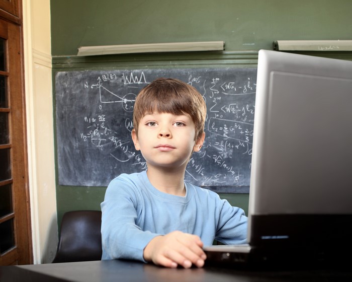 Boy at Laptop in Classroom