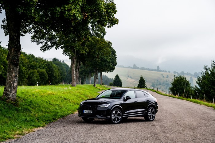 Black Audi Q3 Sportback on a scenic road