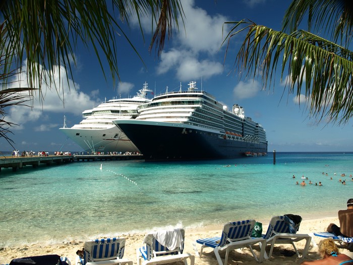Two cruise ships docked at Grand Turk Island with beach chairs