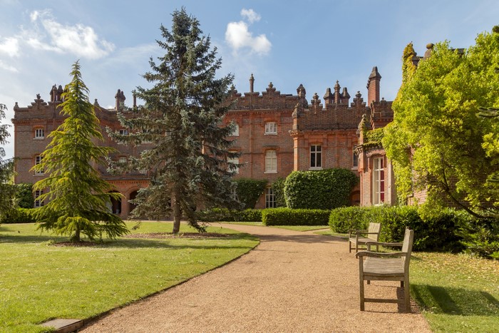 Hughenden Manor garden with benches and trees