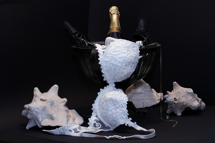 Champagne, shells, bra, and heels