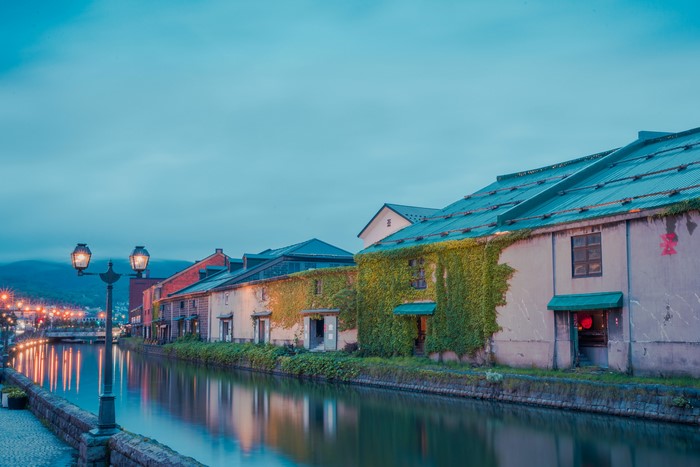 Canal and historic buildings in Otaru, Hokkaido, Japan at dusk