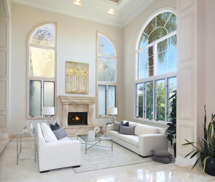 Living room with fireplace and large windows