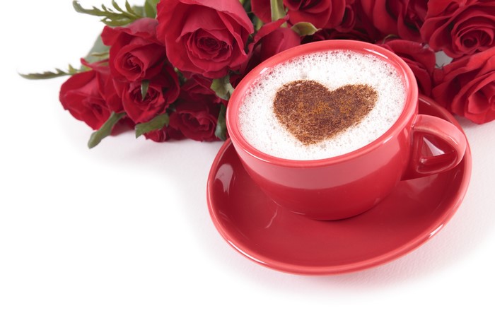 Red roses and cappuccino with heart art