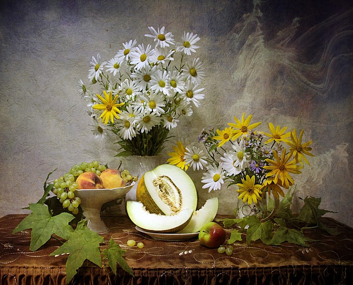 Still-life with bouquets of daisies and yellow flowers, fruits, and melon