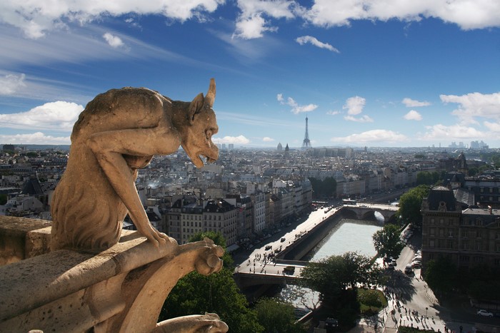 Gargoyle overlooking Paris with Eiffel Tower