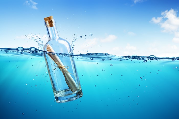 Message in a bottle floating in the sea