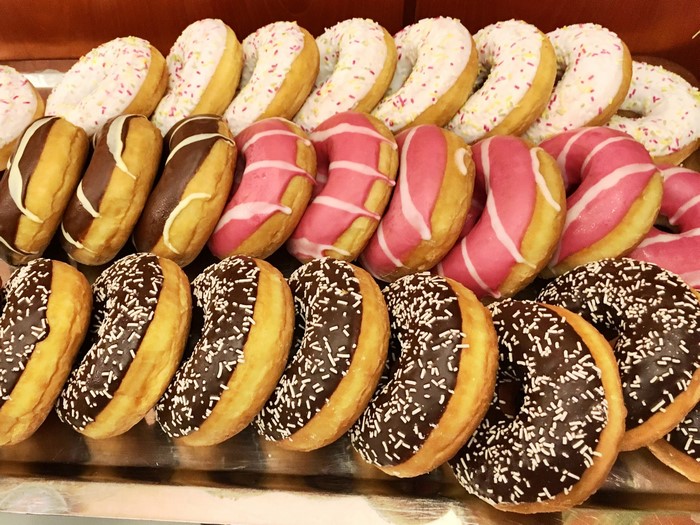 Assortment of decorated donuts on a tray